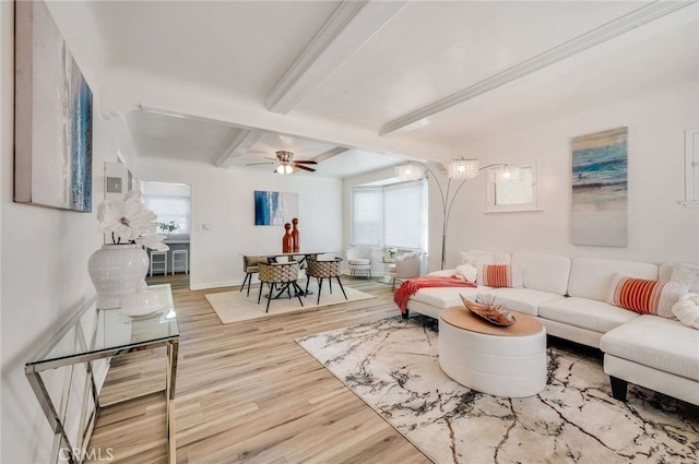 living room with baseboards, a ceiling fan, wood finished floors, and beamed ceiling