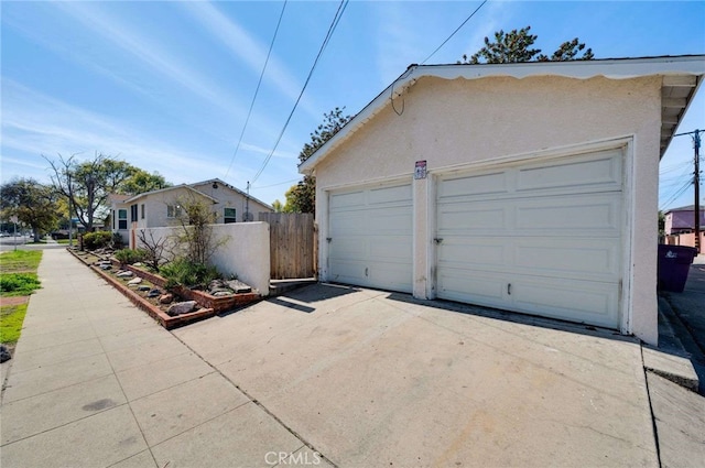 garage with fence