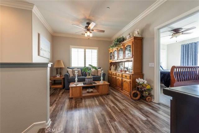 living area with ceiling fan, ornamental molding, and dark wood finished floors