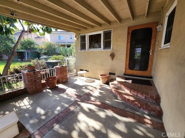 view of patio featuring fence