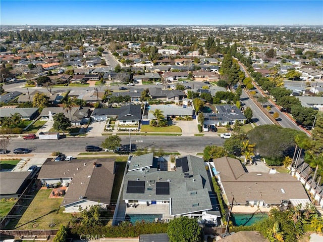 birds eye view of property with a residential view