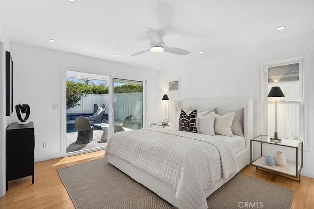 bedroom with recessed lighting, a ceiling fan, light wood-style floors, and access to outside