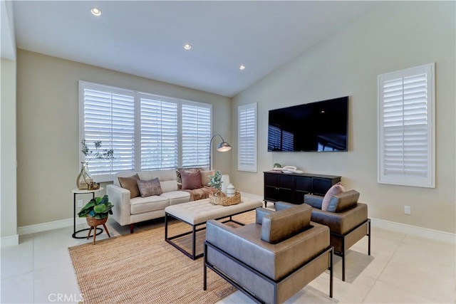 tiled living area featuring vaulted ceiling, baseboards, and recessed lighting