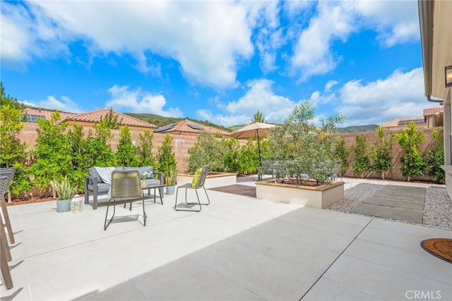 view of patio / terrace with a fenced backyard and outdoor dining space