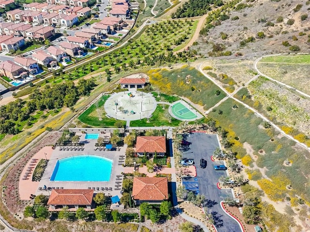 aerial view of property's location featuring a pool