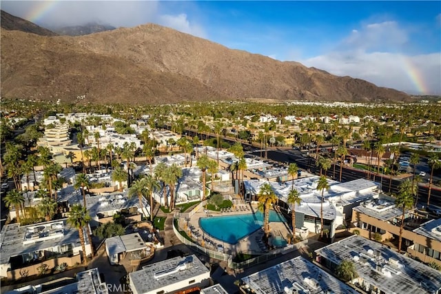 birds eye view of property with a mountain view