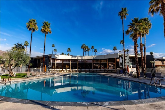 community pool featuring fence