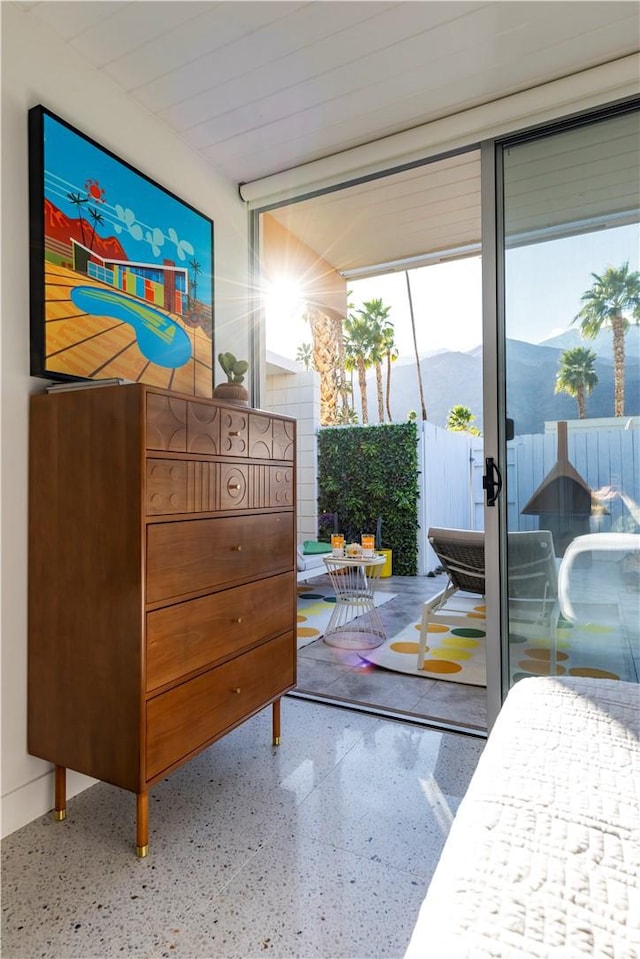 interior space featuring speckled floor and a mountain view