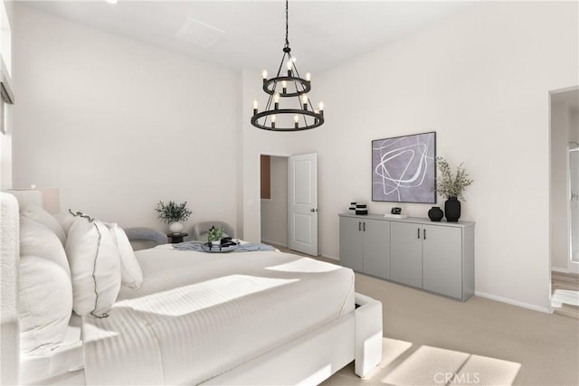 bedroom with light carpet, a notable chandelier, and baseboards