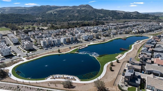 aerial view featuring a residential view and a water and mountain view