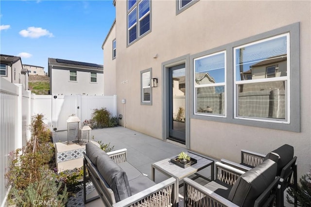 view of patio with fence and an outdoor living space