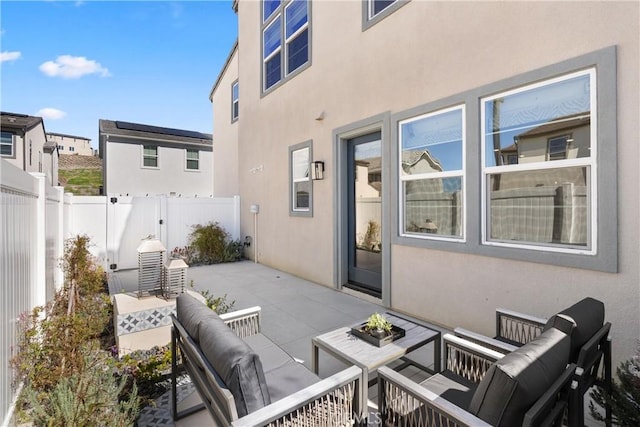view of patio / terrace with an outdoor living space and a fenced backyard
