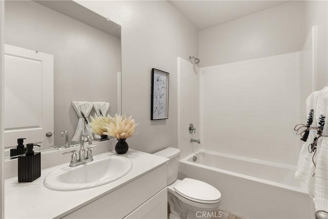 bathroom featuring tub / shower combination, vanity, and toilet
