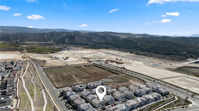 drone / aerial view with a residential view and a mountain view