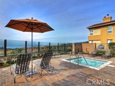 60 Corniche Dr Unit C, Dana Point, CA 92629 - view of pool with a community hot tub, a patio, and a pool