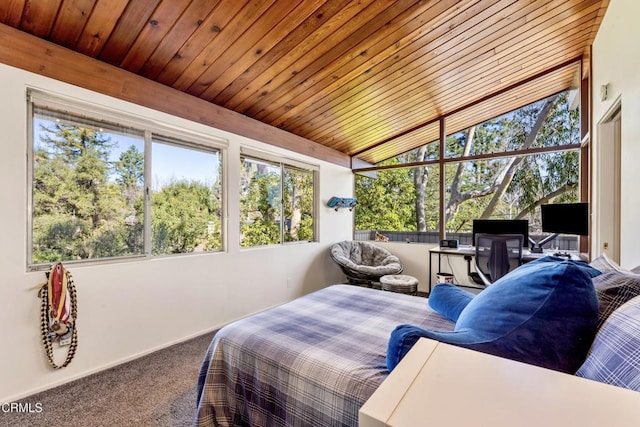 bedroom featuring lofted ceiling, wooden ceiling, and carpet flooring