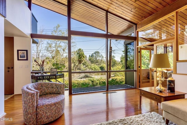 sunroom / solarium with wood ceiling and visible vents