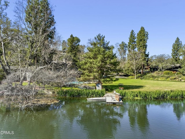 property view of water featuring a floating dock