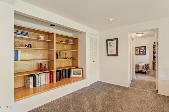 hall with recessed lighting and carpet flooring