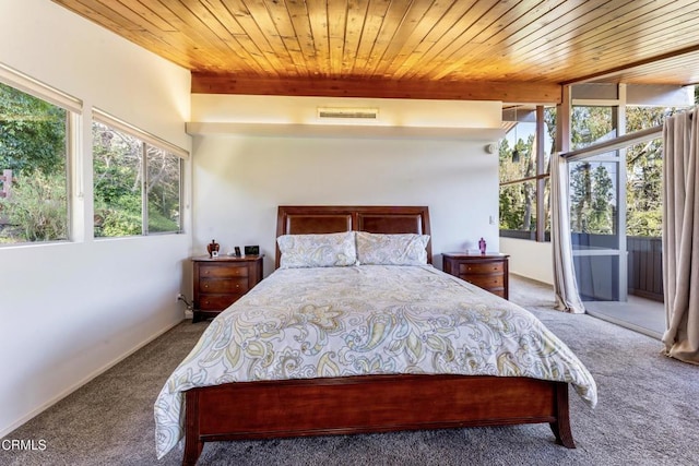 carpeted bedroom with wooden ceiling, access to exterior, visible vents, and beamed ceiling