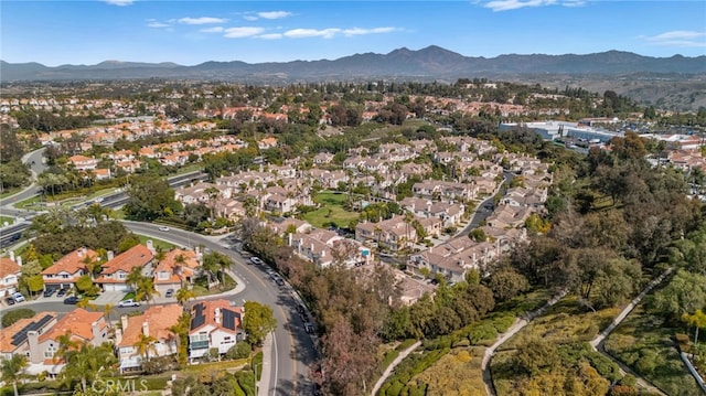 birds eye view of property with a residential view and a mountain view