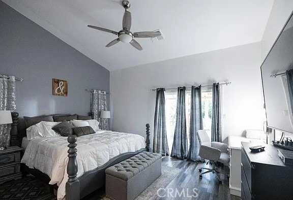 bedroom featuring dark wood-style floors, visible vents, ceiling fan, and high vaulted ceiling