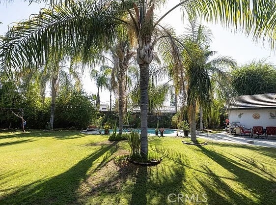 view of yard with an outdoor pool