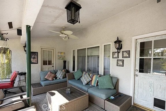 view of patio with ceiling fan and outdoor lounge area