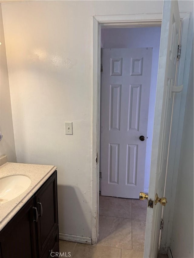 bathroom featuring tile patterned flooring and vanity