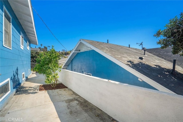 view of home's exterior featuring a patio area and fence