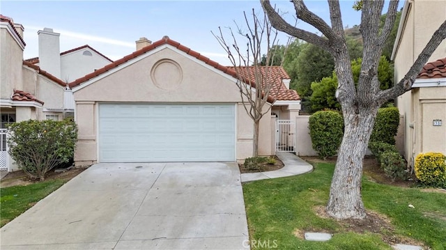 mediterranean / spanish-style home featuring driveway, stucco siding, a garage, and a tiled roof