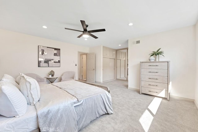 bedroom with a ceiling fan, recessed lighting, visible vents, and light carpet