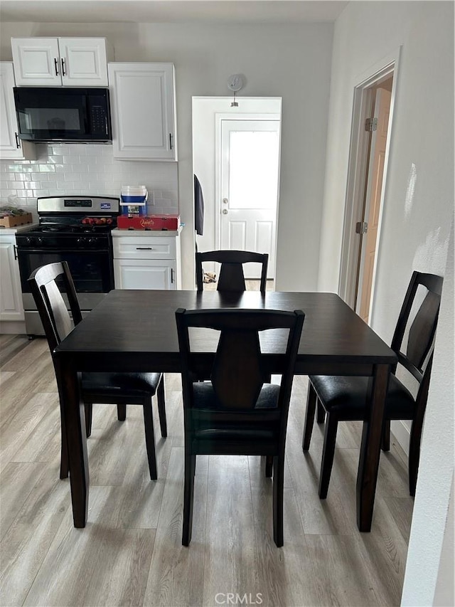 dining room featuring light wood-type flooring