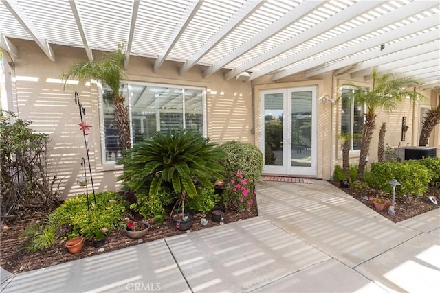 exterior space featuring a pergola and french doors