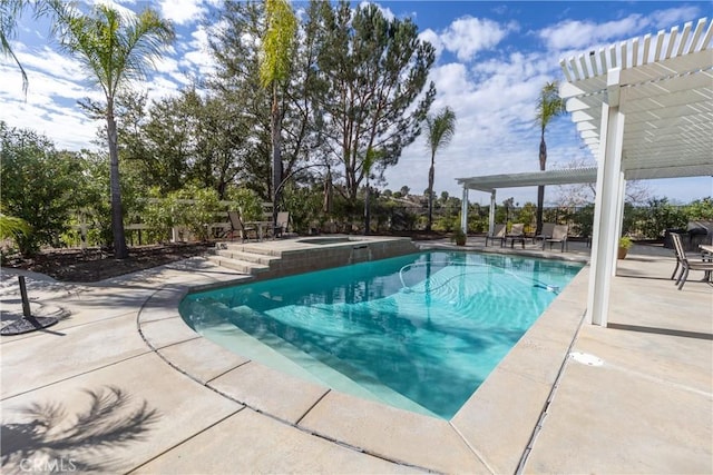 pool with a patio area, a pergola, and an in ground hot tub