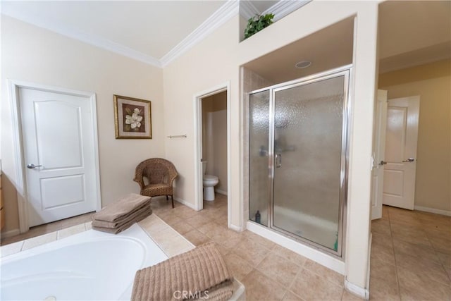 full bathroom featuring toilet, ornamental molding, a garden tub, tile patterned flooring, and a shower stall