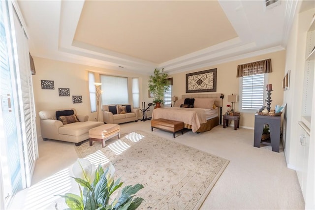 bedroom with light carpet, baseboards, visible vents, a raised ceiling, and ornamental molding