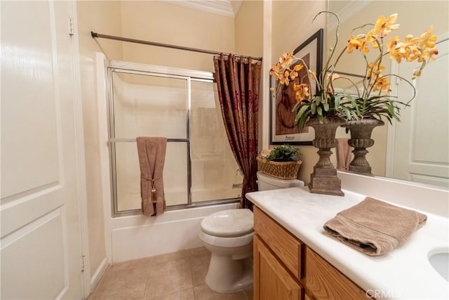 full bath with crown molding, toilet, enclosed tub / shower combo, vanity, and tile patterned floors