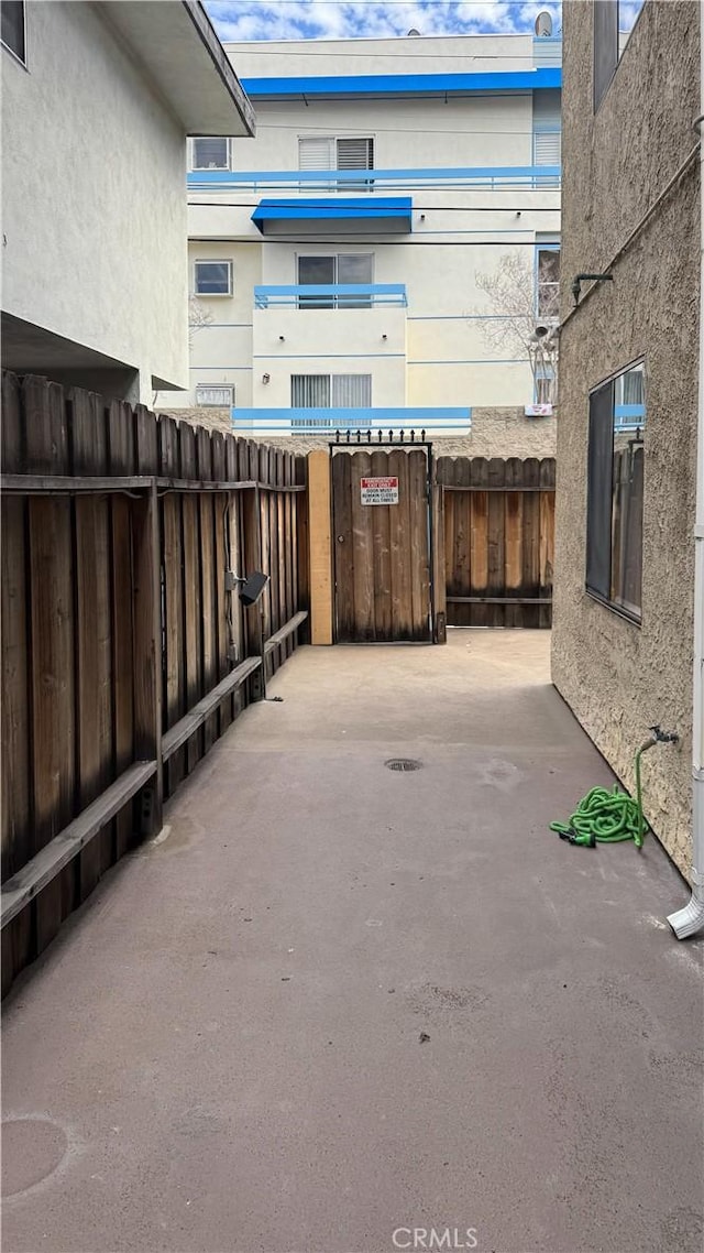 view of patio featuring fence