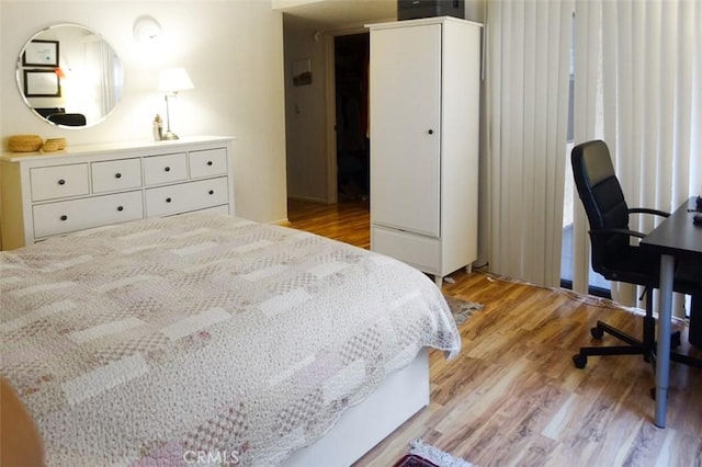 bedroom with light wood-style floors