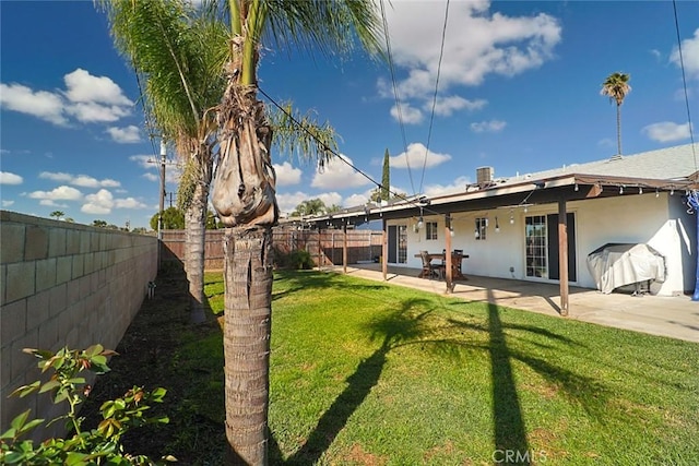 view of yard featuring a fenced backyard and a patio area