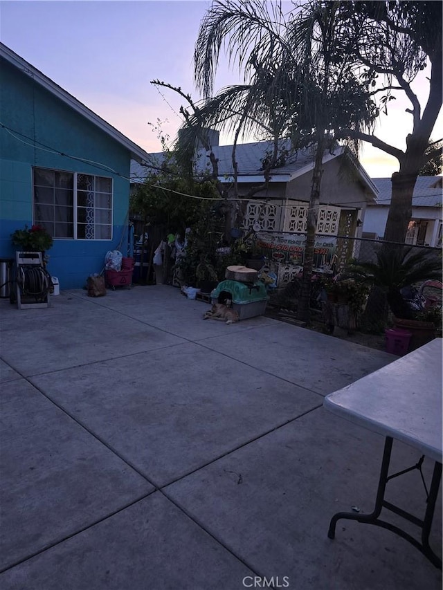 view of patio terrace at dusk