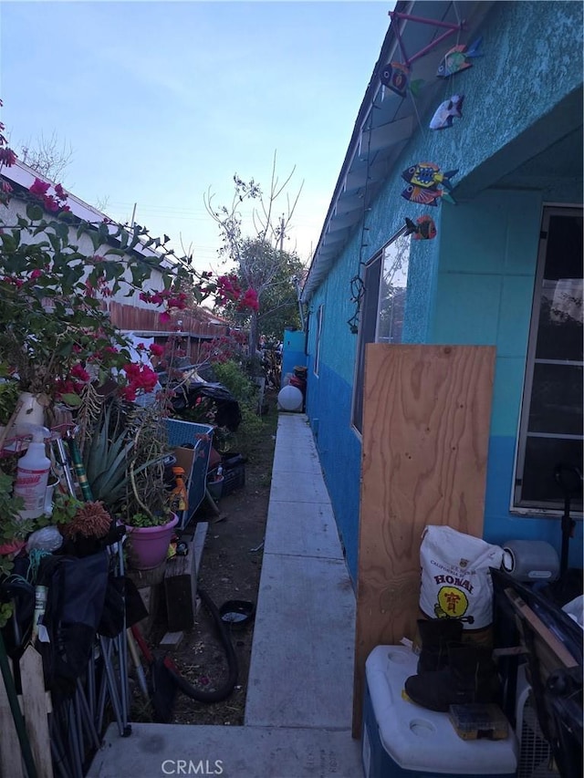 view of home's exterior featuring fence