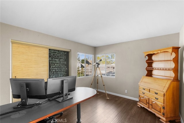 office space with dark wood-style floors and baseboards