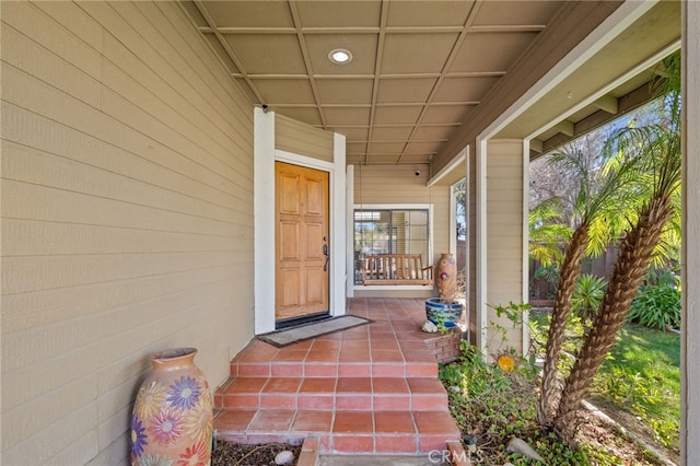 doorway to property featuring covered porch