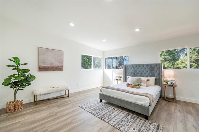 bedroom featuring recessed lighting, wood finished floors, and baseboards