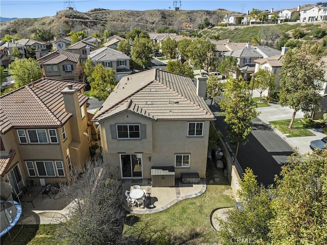 drone / aerial view featuring a residential view and a mountain view