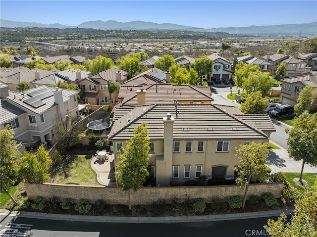 drone / aerial view featuring a mountain view and a residential view