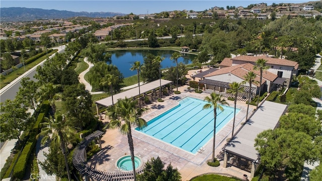 birds eye view of property featuring a water view and a residential view