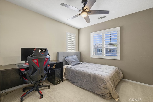 bedroom with carpet floors, a ceiling fan, visible vents, and baseboards